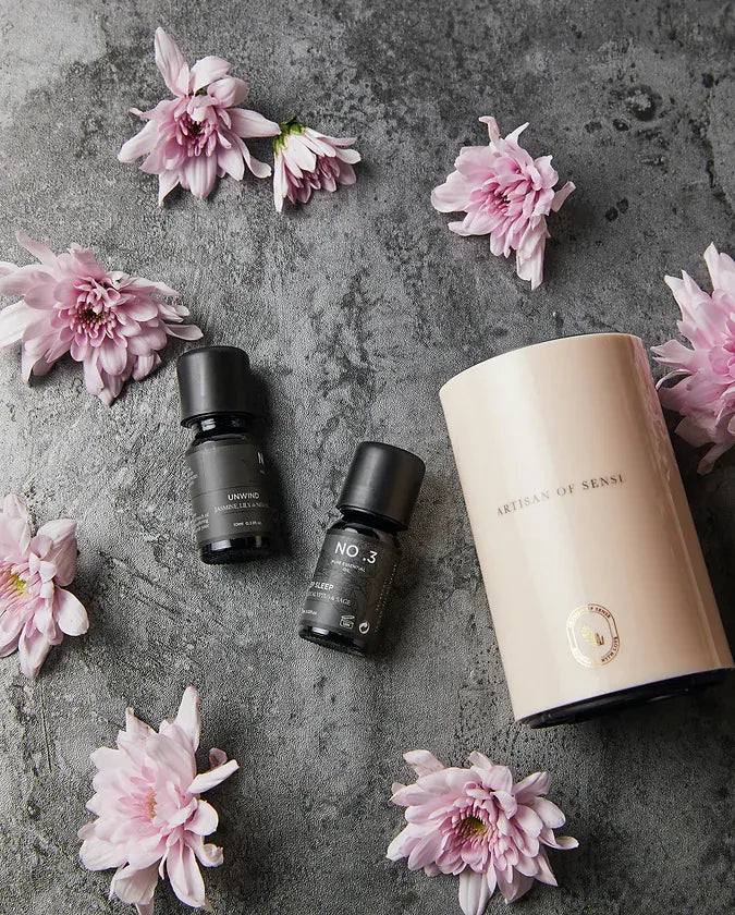 Portable ultrasonic diffuser set in Pink, White, or Black, includes AOS Essential Oil Blend for on-the-go aromatherapy.