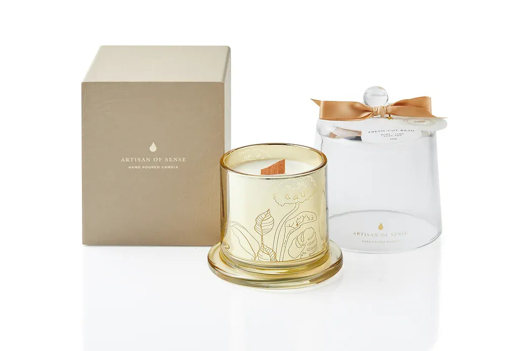 A uniquely designed soy candle, hand-poured with essential oils and set in a luxurious gold glass vessel with a glass dome. The FSC wooden wick offers a comforting crackling sound. Packaged sustainably for easy gifting.
Scent: Fresh-Cut Basil & Mint.