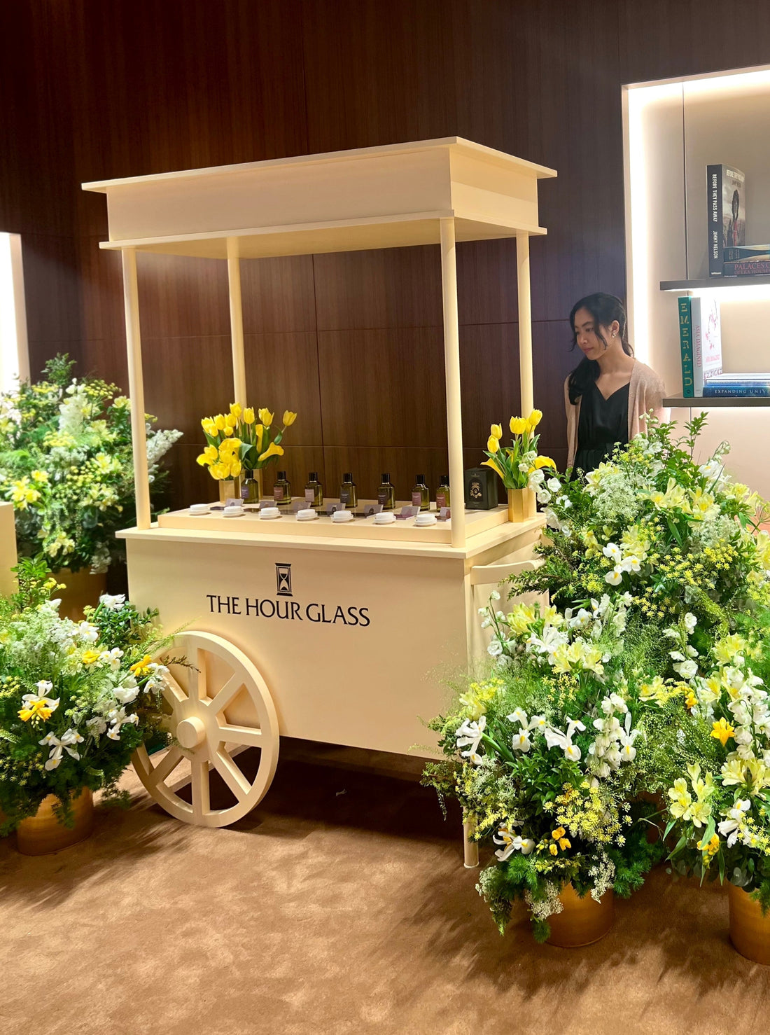 Bespoke luxury mobile fragrance cart with yellow botanical floral arrangements by Artisan of Sense for The Hour Glass VIP event in Singapore