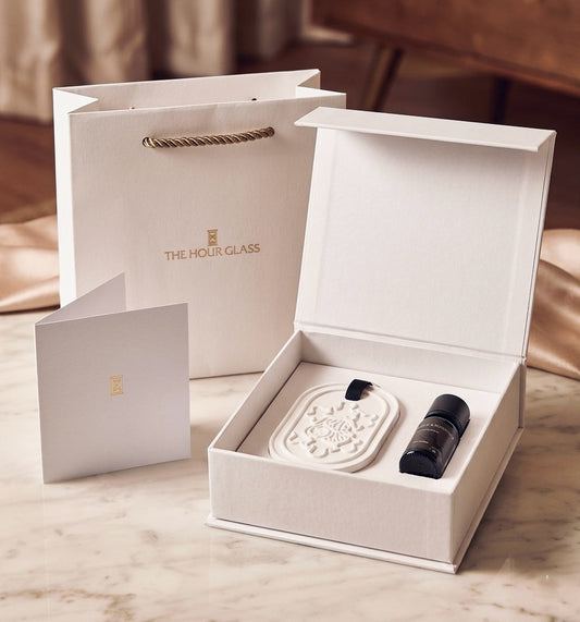 Custom branded luxury corporate gift box with porous clay diffuser and pure essential oil blend for The Hour Glass by Artisan of Sense Singapore.