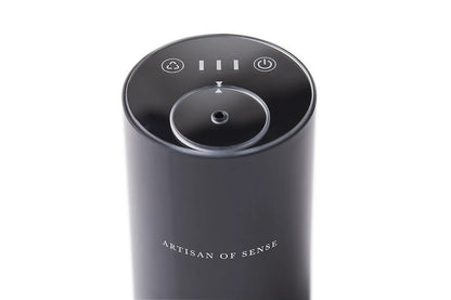 Portable ultrasonic diffuser set in Pink, White, or Black, includes AOS Essential Oil Blend for on-the-go aromatherapy.