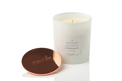 Natural Cedarwood & Lemongrass soy candle with a clean-burning cotton wick, presented in a classic pink box.