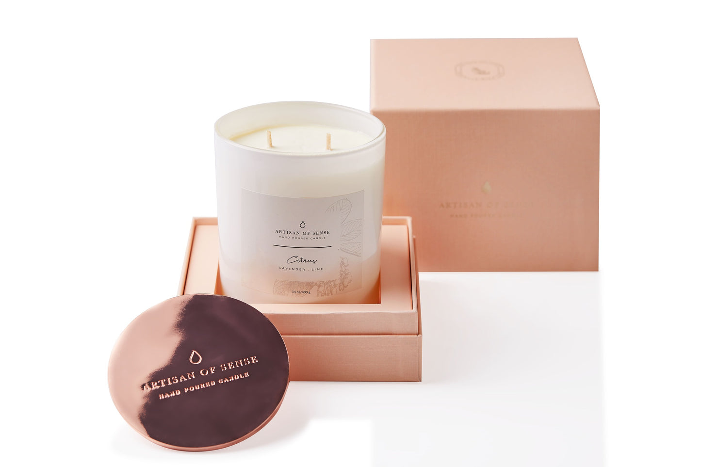 Lemongrass scented soy candle, handcrafted with a cotton wick, in its classic pink box.