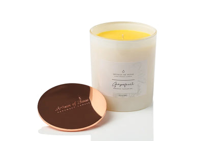 Handcrafted Grapefruit, Orange & Tangerine soy candle featuring a cotton wick, packaged sustainably.
