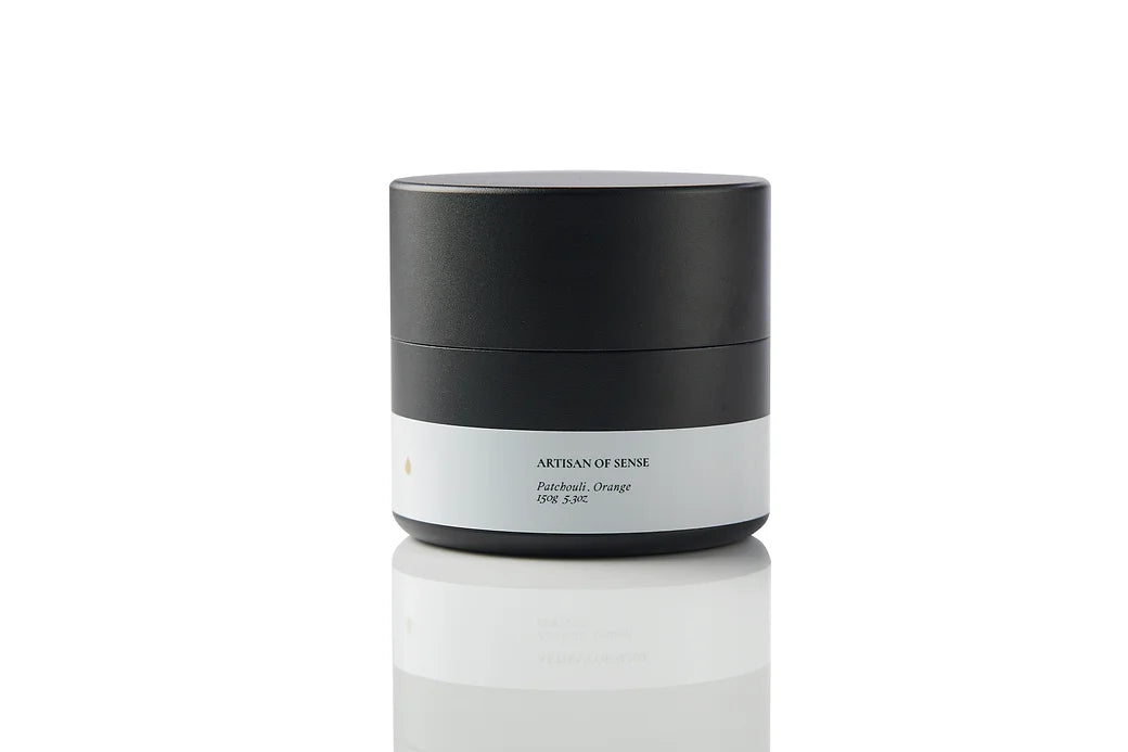 Compact tin candle with natural Patchouli Orange fragrance, cotton wick, for home comfort on the go. Offering a sensory journey for relaxation.