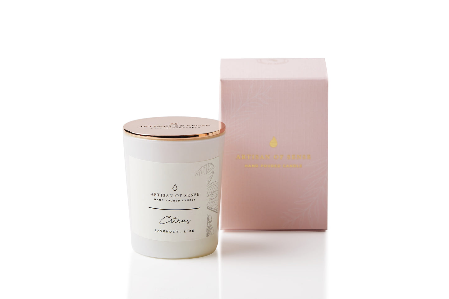 The warm glow of a handcrafted Bergamot & Clove soy candle. It sits elegantly in a glass jar, in sustainable packaging perfect for a unique gift. Small scented candle.

