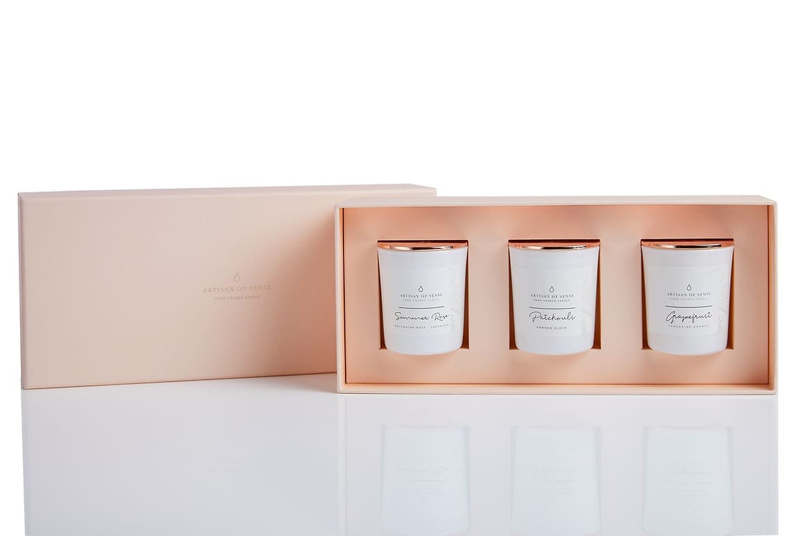 Elegant gift set containing three natural scented candles for a sensory experience.