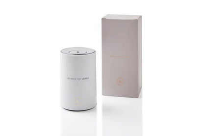 Portable ultrasonic diffuser set in Pink, White, or Black, includes AOS Essential Oil Blend for on-the-go aromatherapy.